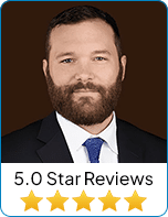 Professional portrait of Travis Granger with 5-star reviews.