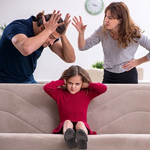Child covers ears while parents argue; illustration of family conflict, divorce, or child custody.