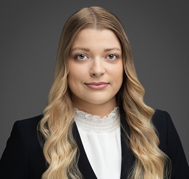 Ellie Naumann professional headshot; top-rated attorney with 5-star reviews for legal services.